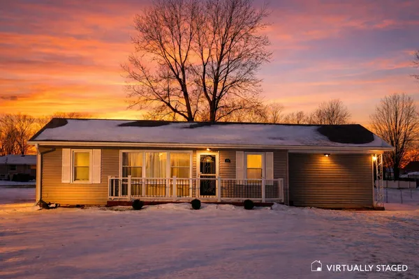 a view of an house with backyard space and balcony