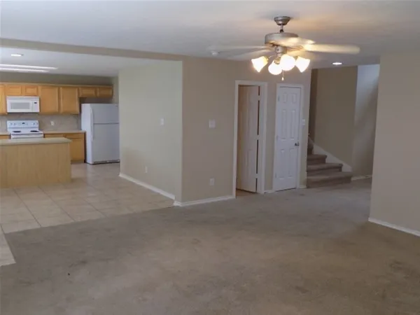 a view of hallway with windows