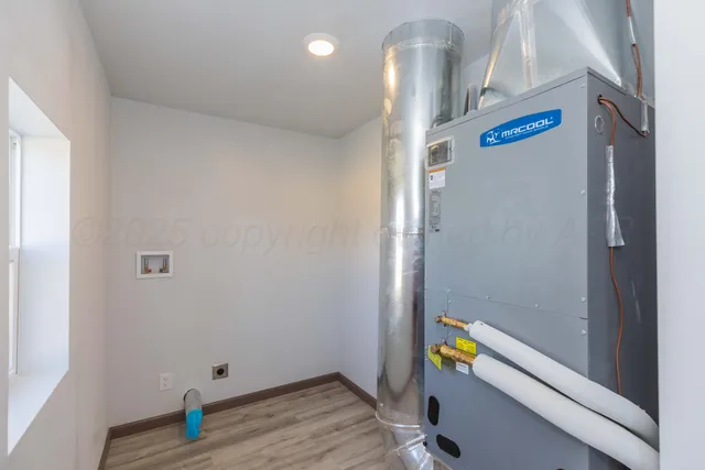 a view of an entryway with wooden floor