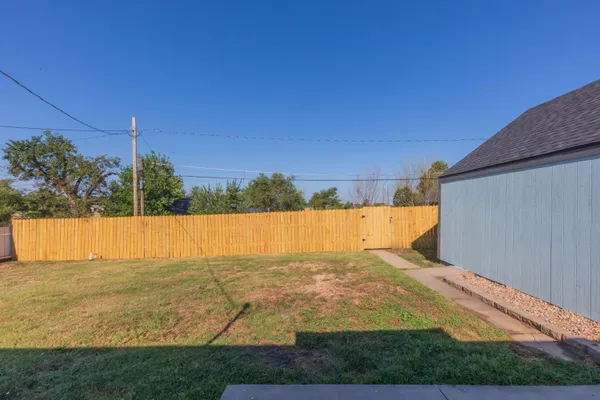 a view of a swimming pool and a yard