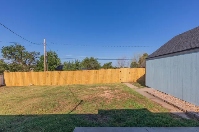 a view of a swimming pool and a yard