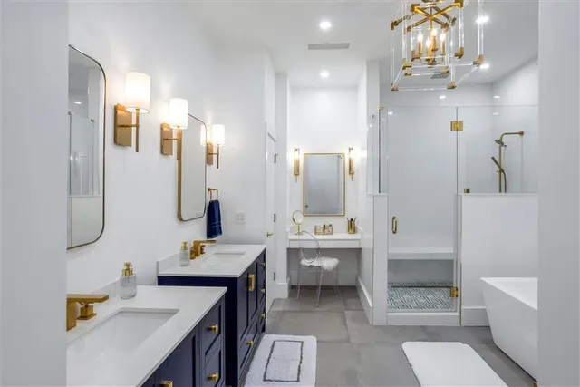 a living room with furniture a flat screen tv and kitchen view
