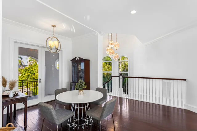 a bedroom with a bed and a flat tv screen on dresser