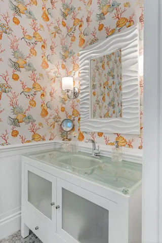 a view of a backyard with plants and lake view