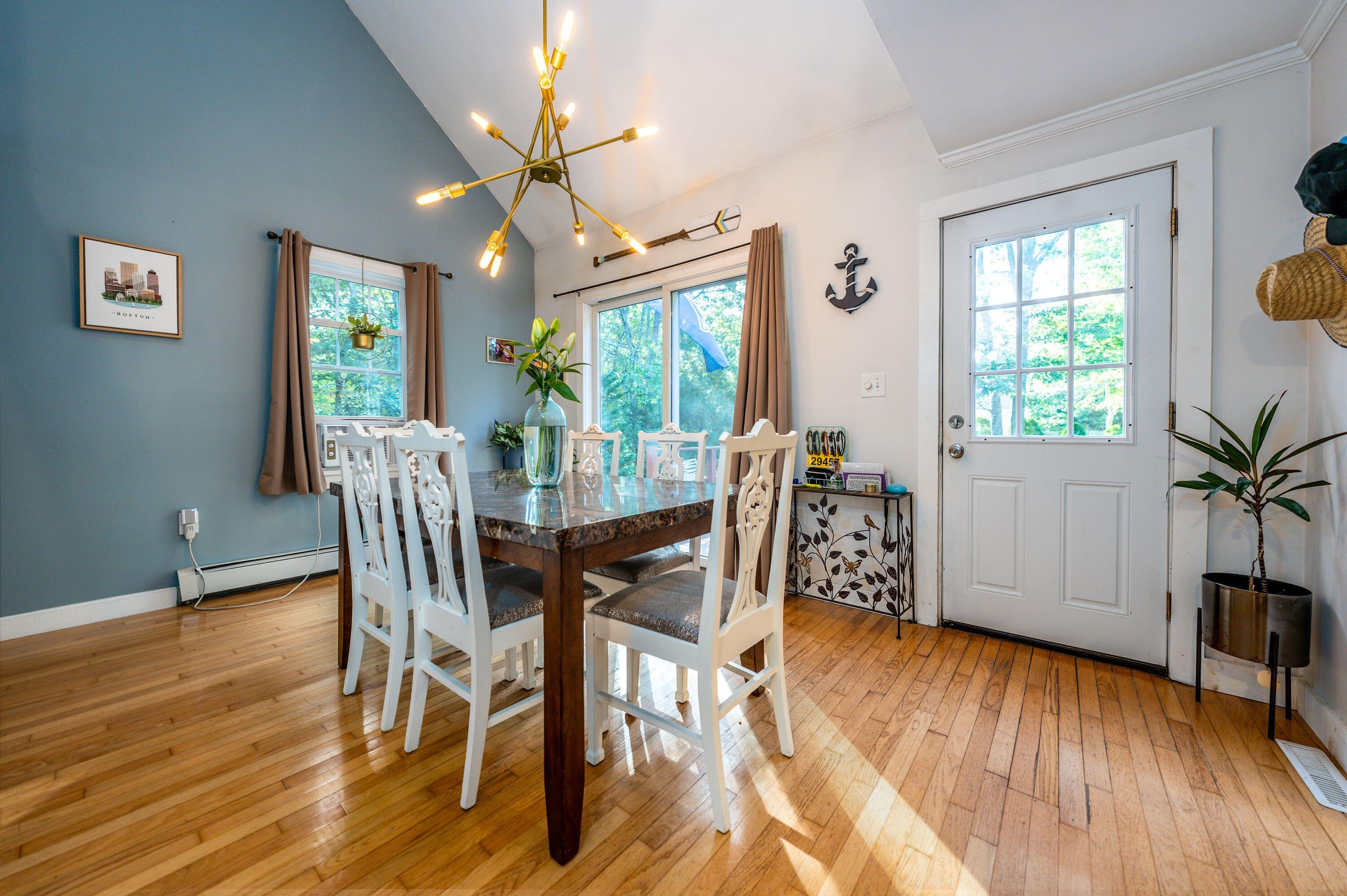171 Cap'n Lijah's Road Centerville, MA 02632 - Photo 15 of 31 a view of a dining room with furniture window and wooden floor