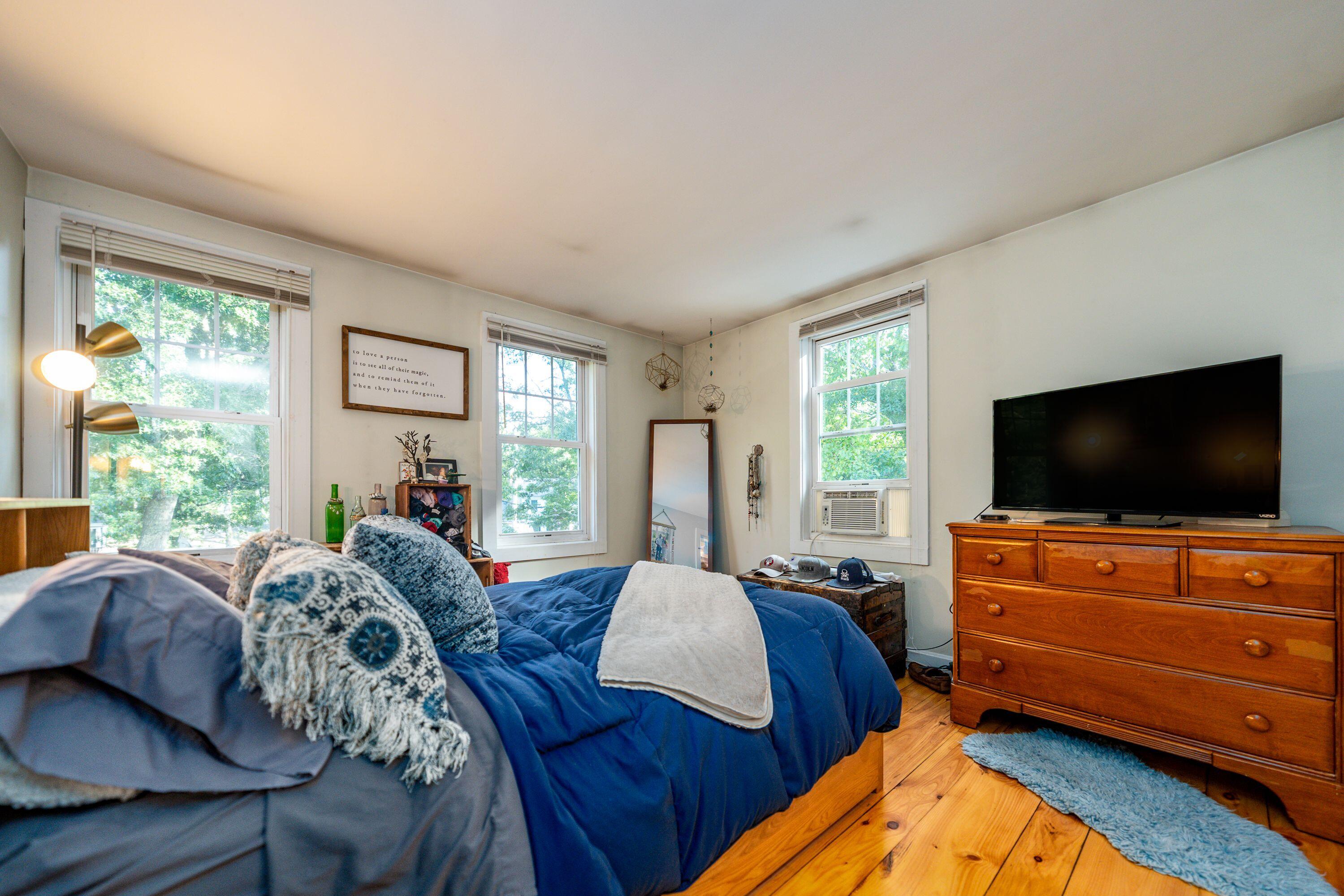 171 Cap'n Lijah's Road Centerville, MA 02632 - Photo 23 of 31 a bedroom with furniture and a flat screen tv