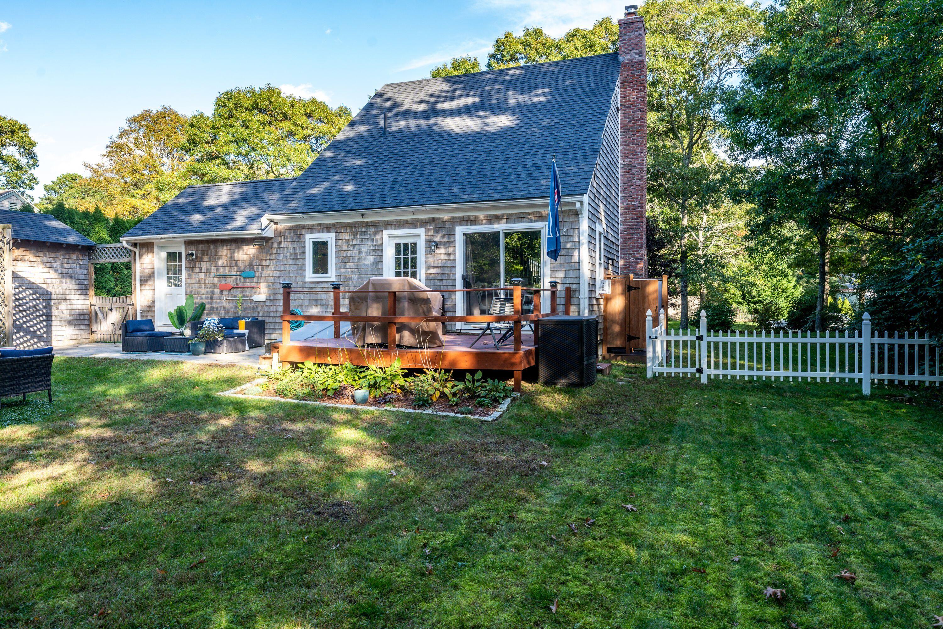 171 Cap'n Lijah's Road Centerville, MA 02632 - Photo 28 of 31 a view of a house with a yard porch and sitting area