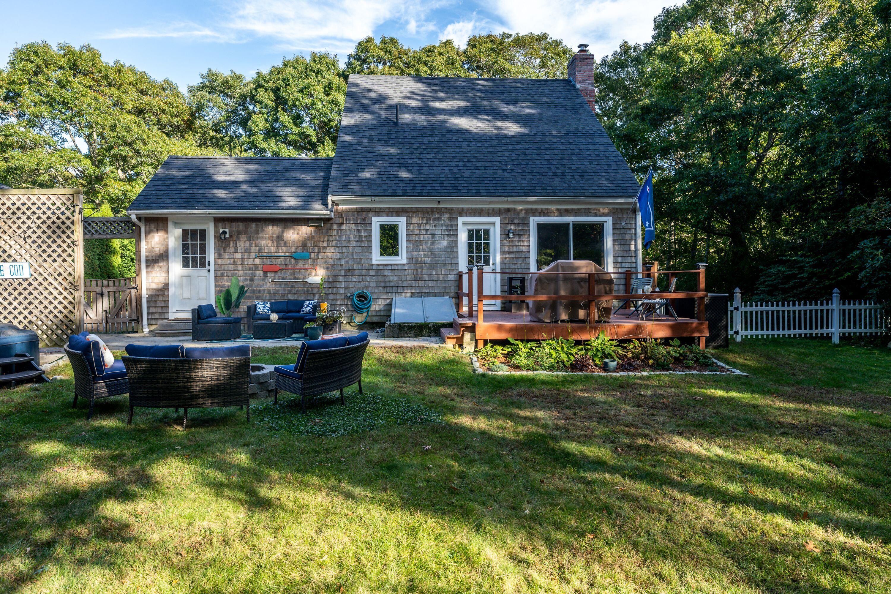 171 Cap'n Lijah's Road Centerville, MA 02632 - Photo 6 of 31 a view of a house with a yard porch and sitting area