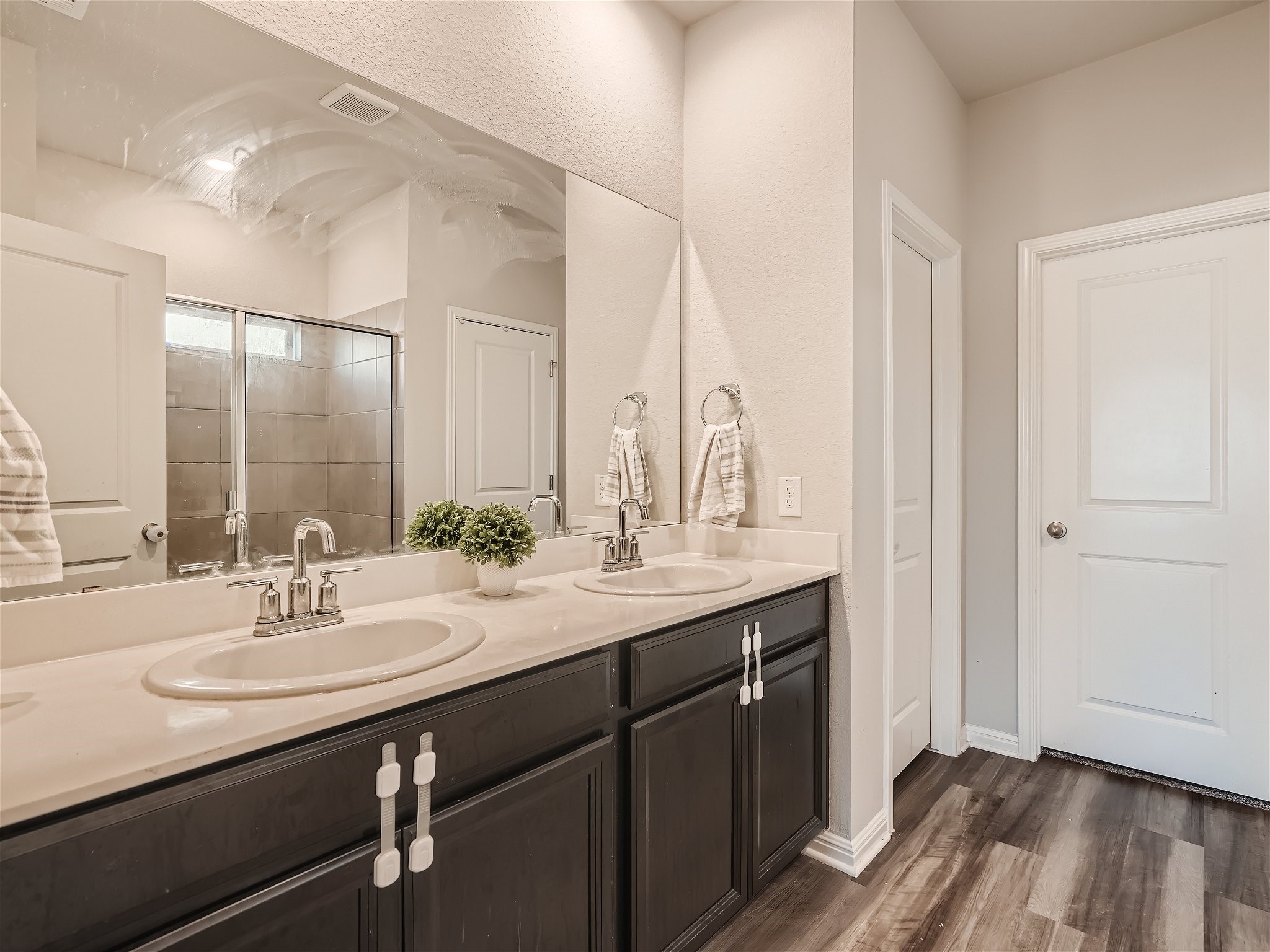 1416 Deering Run Leander, TX 78641 - Photo 12 of 21 a bathroom with a sink double vanity and a mirror