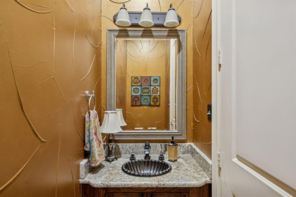 1520 Snider Court Lucas, TX 75002 - Photo 10 of 40 1/2 bath for guests is 1/2 way between the back door and the motor court exterior door.