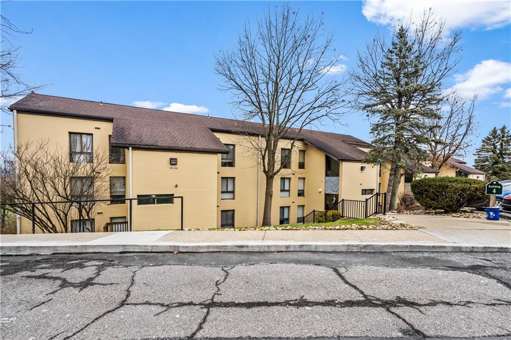 2034 Swallow Hill Road, Unit 403 Pittsburgh, PA 15220 - Photo 6 of 8 front view of a building with a street