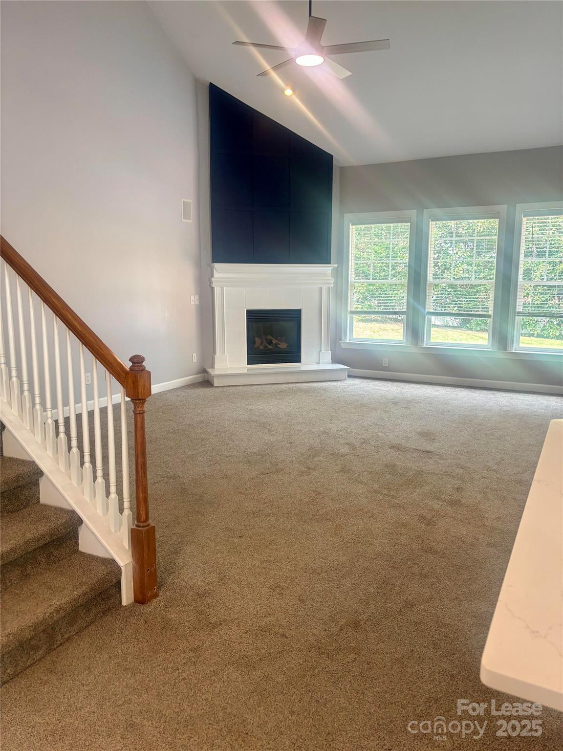 18705 The Commons Boulevard Cornelius, NC 28031 - Photo 12 of 19 a view of an empty room with a fireplace and a window