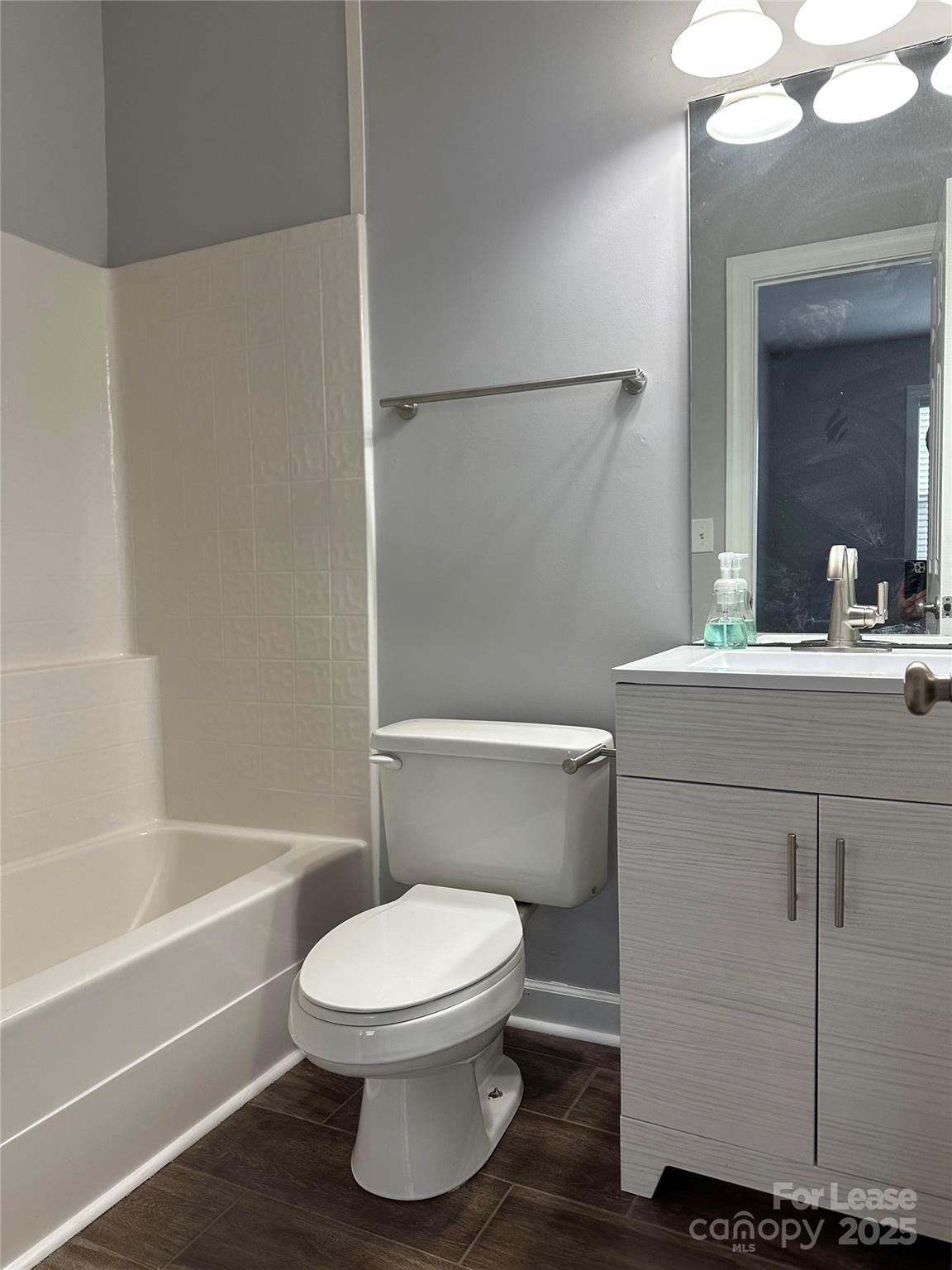 18705 The Commons Boulevard Cornelius, NC 28031 - Photo 15 of 19 a bathroom with a sink a toilet and shower