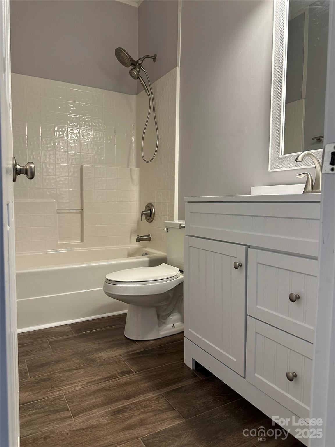 18705 The Commons Boulevard Cornelius, NC 28031 - Photo 16 of 19 a bathroom with a sink a toilet and shower