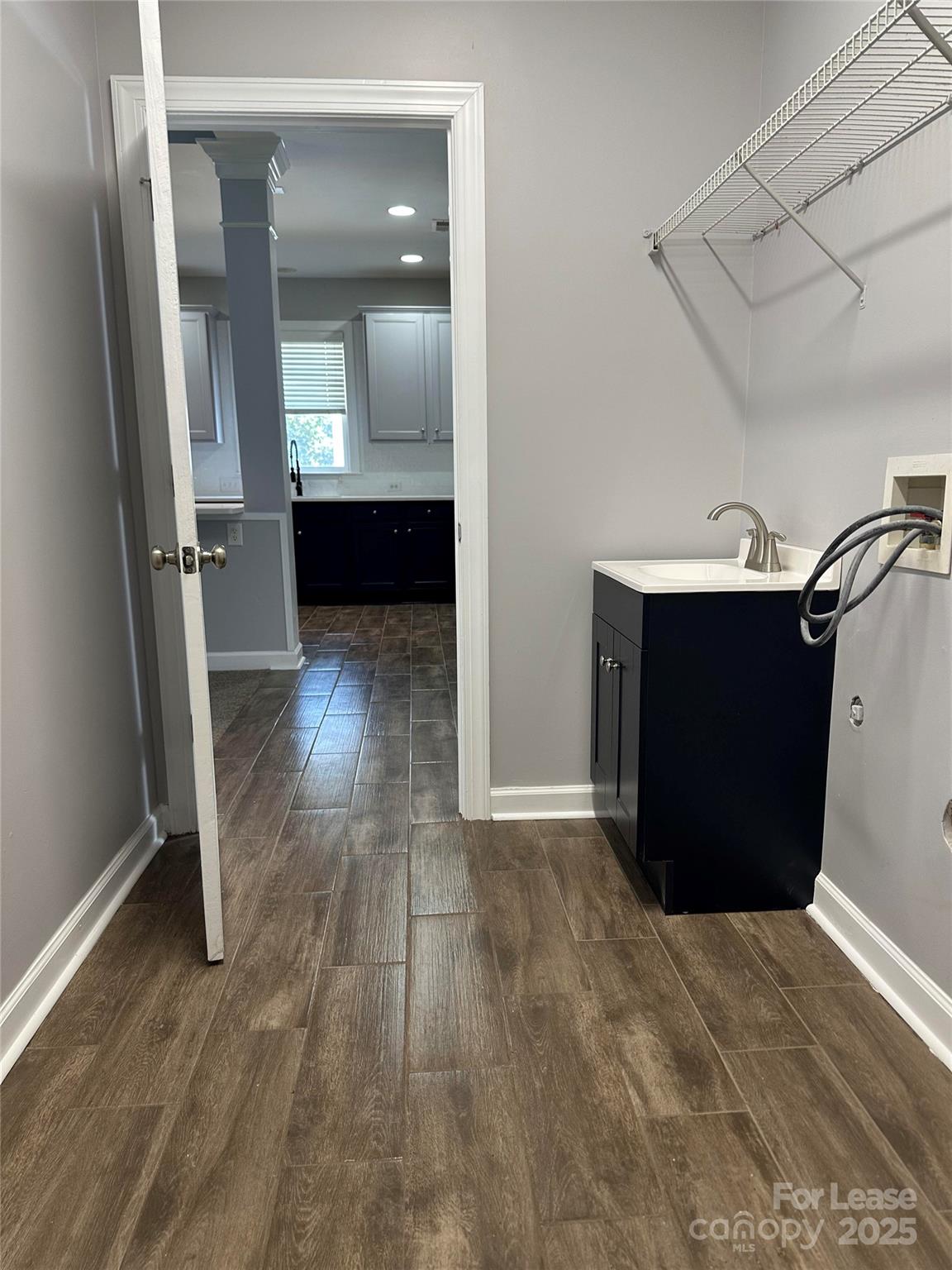18705 The Commons Boulevard Cornelius, NC 28031 - Photo 17 of 19 an empty room with wooden floor and windows