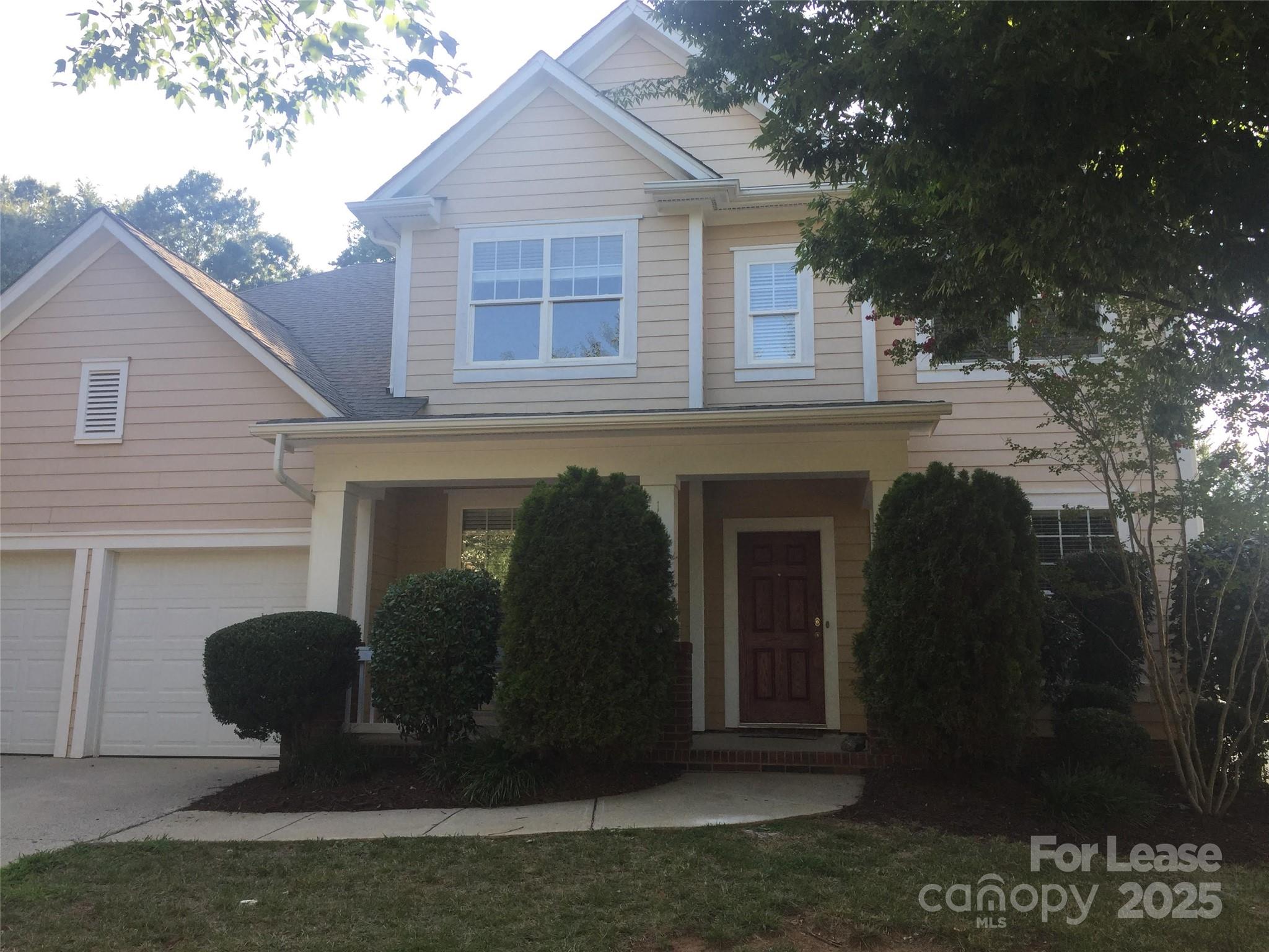 18705 The Commons Boulevard Cornelius, NC 28031 - Photo 18 of 19 a front view of a house with garden