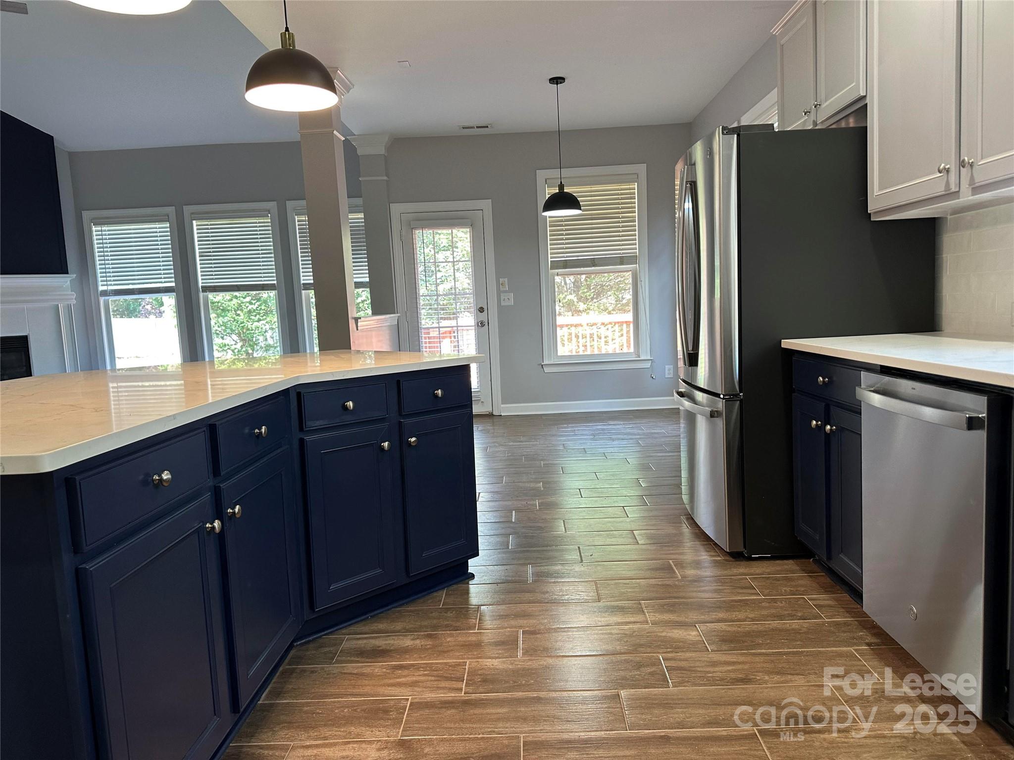 18705 The Commons Boulevard Cornelius, NC 28031 - Photo 5 of 19 a kitchen with stainless steel appliances granite countertop a refrigerator a sink dishwasher a stove and a refrigerator