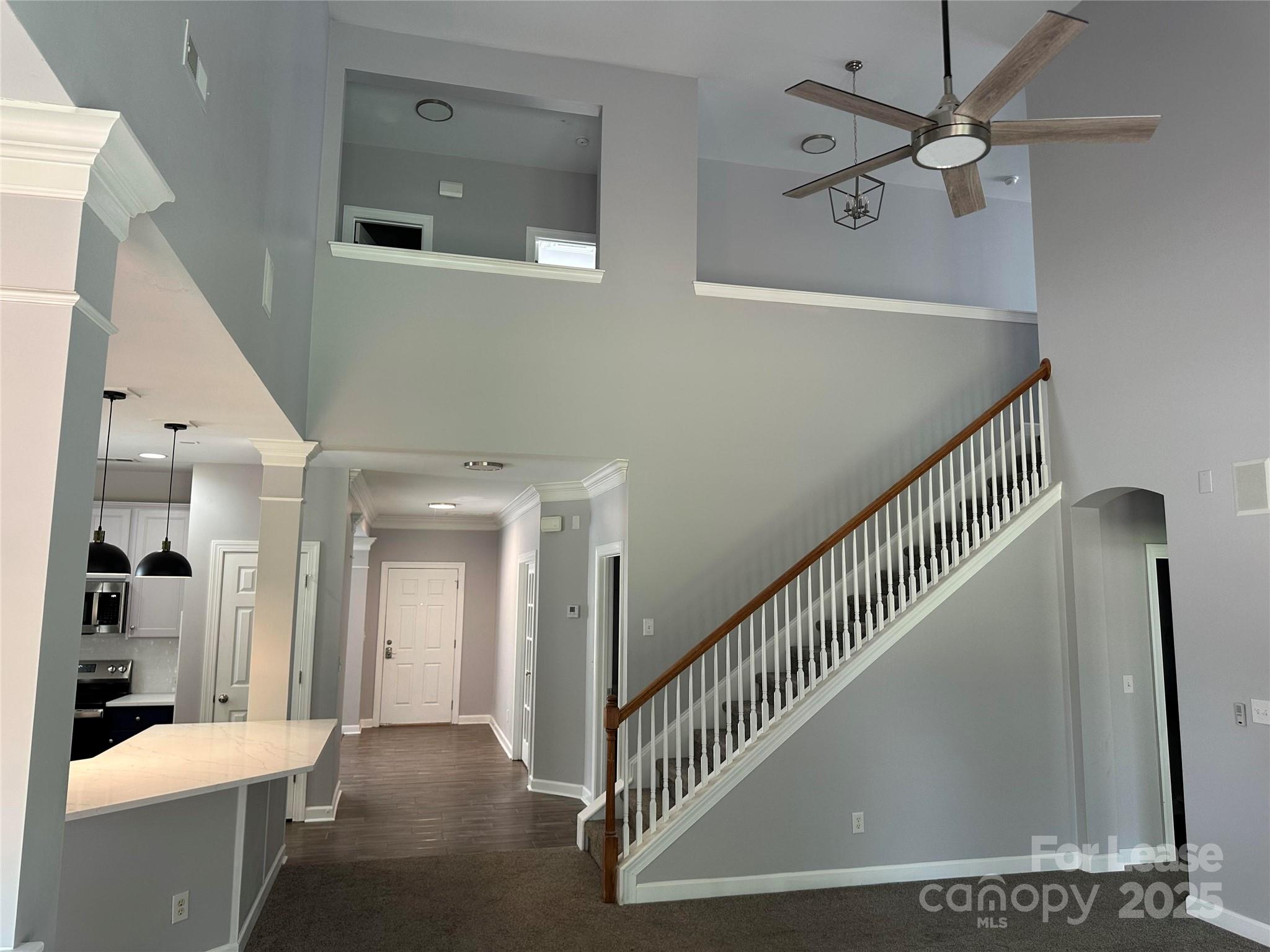 18705 The Commons Boulevard Cornelius, NC 28031 - Photo 7 of 19 a view of a hallway with entryway and wooden floor