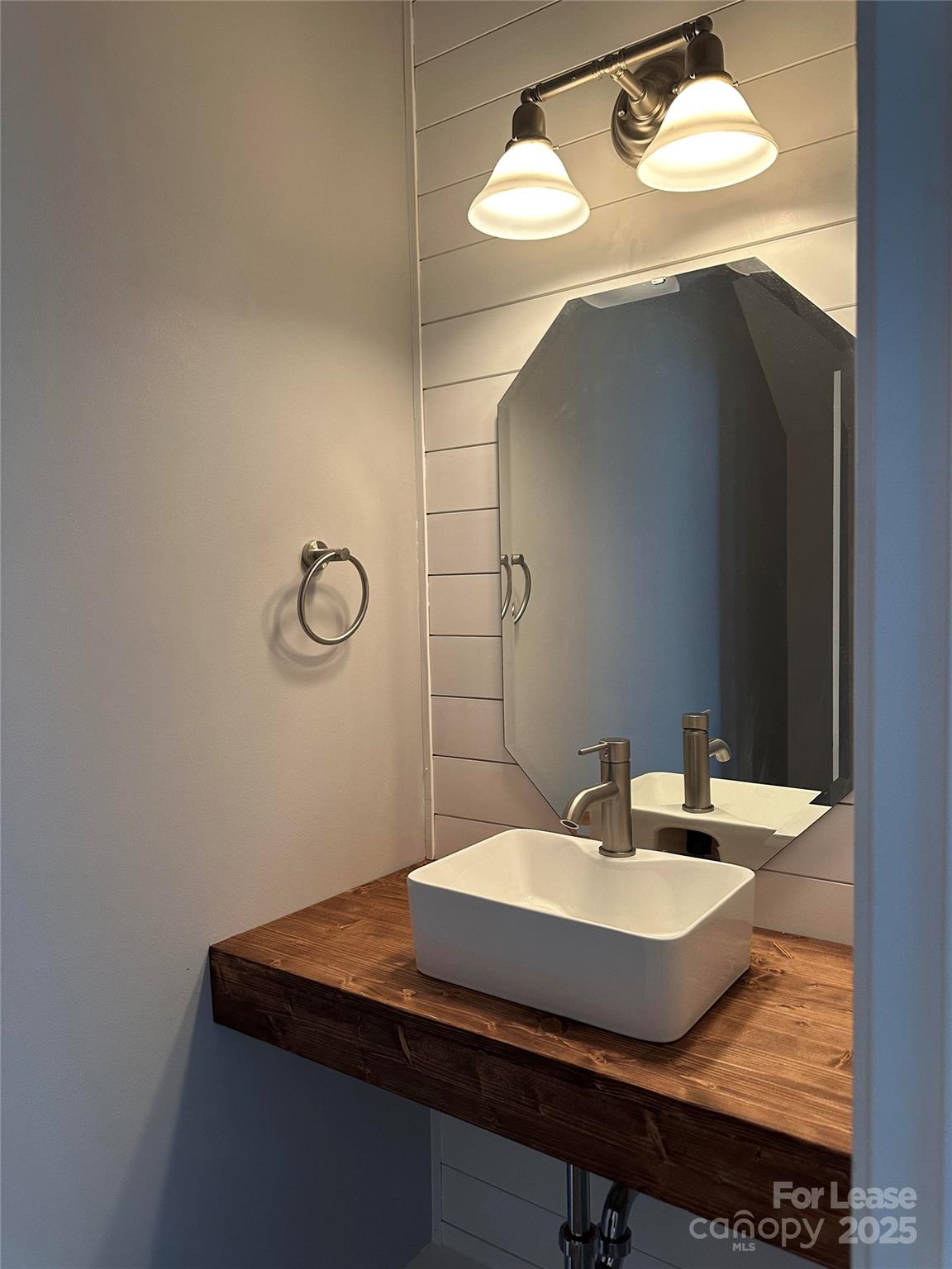 18705 The Commons Boulevard Cornelius, NC 28031 - Photo 8 of 19 a bathroom with a sink and mirror