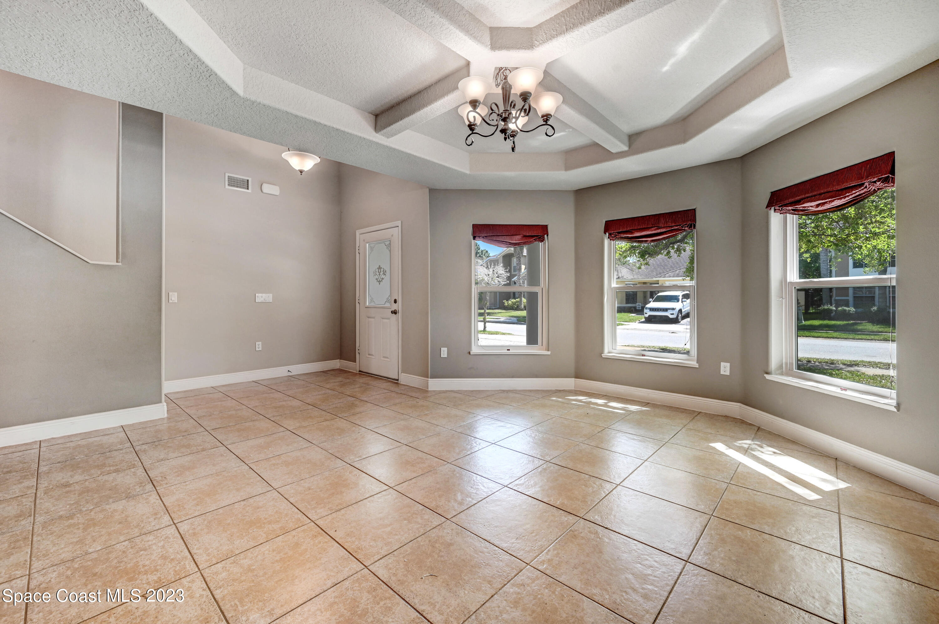 1202 Becket Place Melbourne, FL 32940 - Photo 8 of 56 a view of an empty room with a window