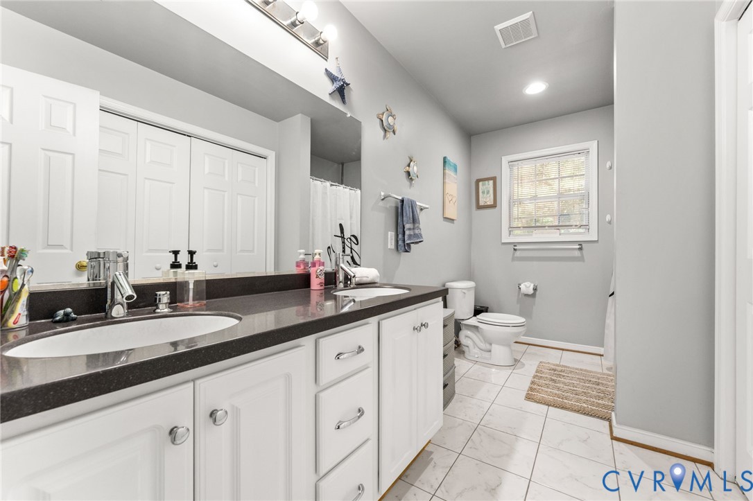 3120 Denise Road Petersburg, VA 23805 - Photo 48 of 51 Double vanity with dark countertop, undermount sin