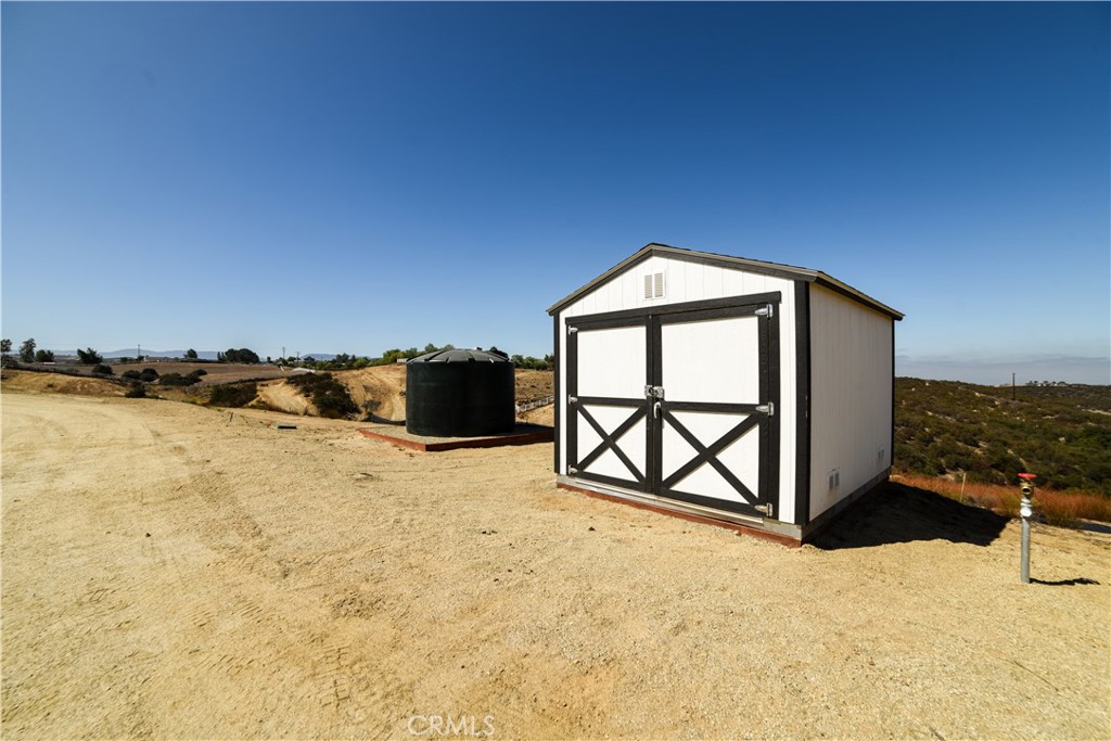 40495 East Benton Road Temecula, CA 92592 - Photo 32 of 45 a front view of a house with a yard