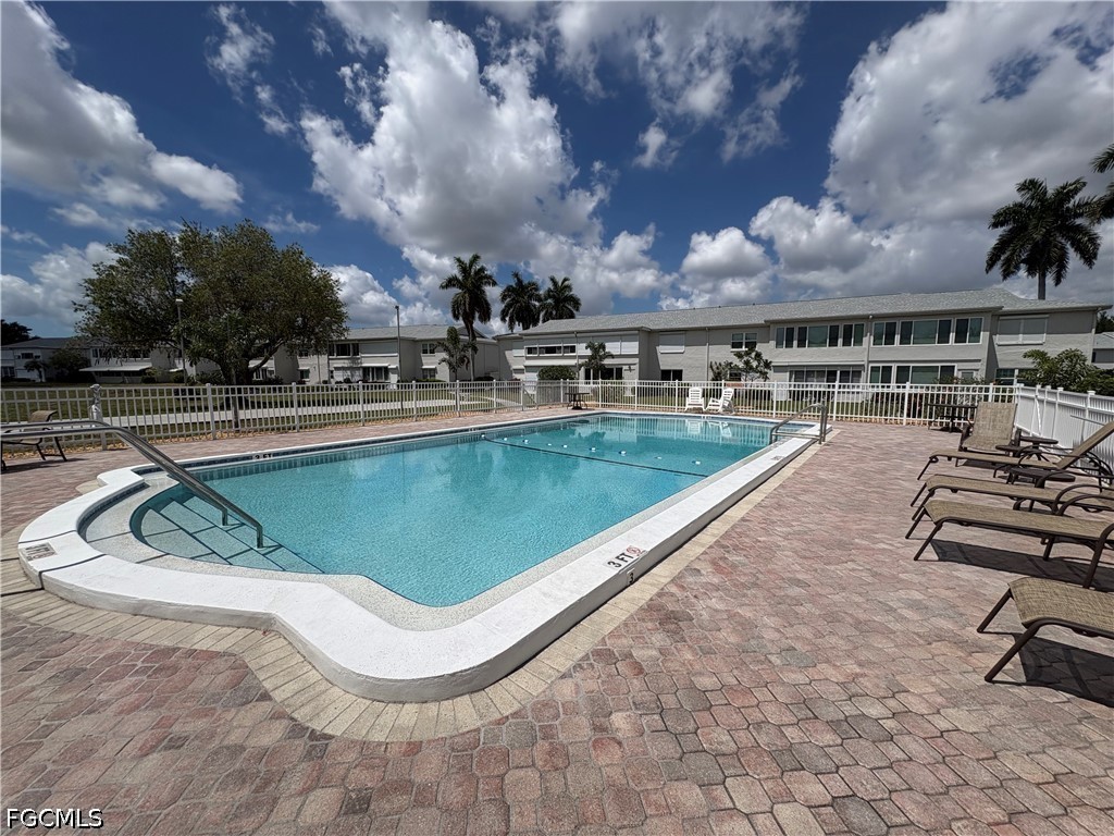 1830 Brantley Road, Unit I7 Fort Myers, FL 33907 - Photo 32 of 34 a view of a swimming pool with a lounge chair
