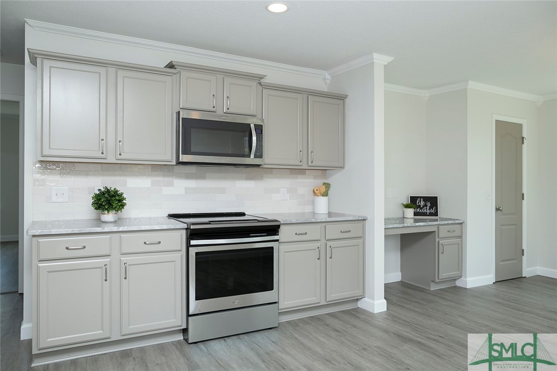 10 Fitzwater Road Port Wentworth, GA 31407 - Photo 15 of 48 Island kitchen with counter height bar featuring n