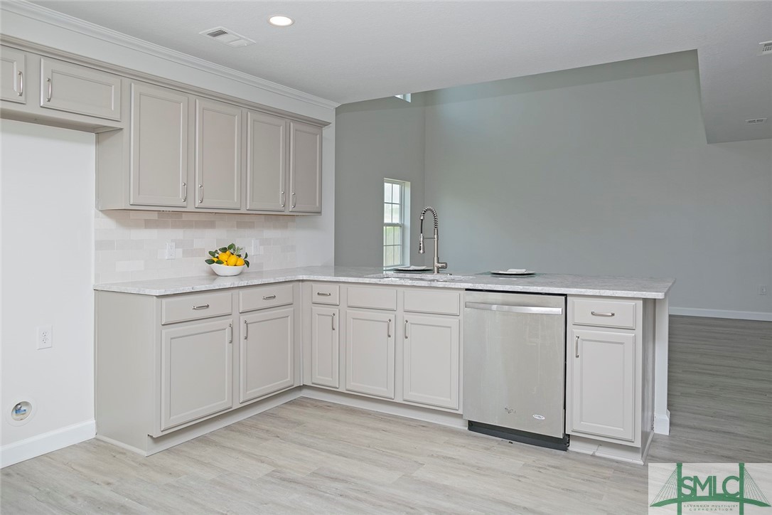 10 Fitzwater Road Port Wentworth, GA 31407 - Photo 18 of 48 Island kitchen with counter height bar featuring n