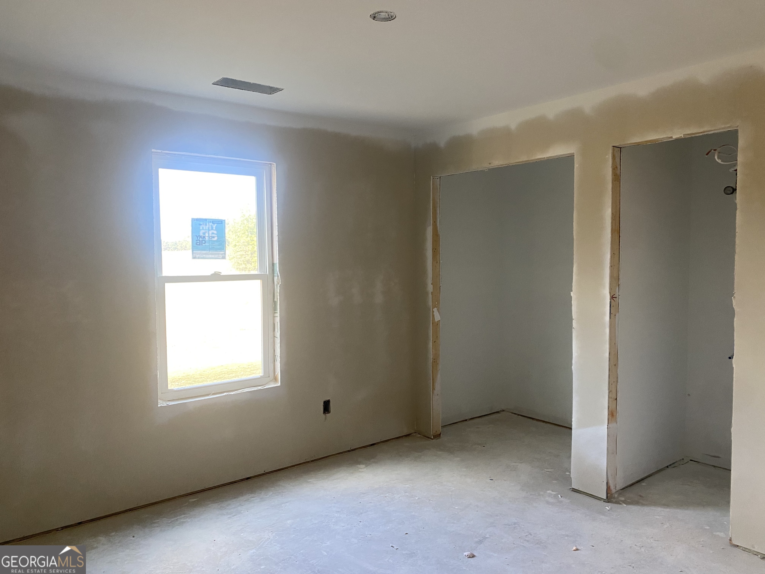 166 Mathews Road Milner, GA 30257 - Photo 11 of 14 a view of an empty room with a window