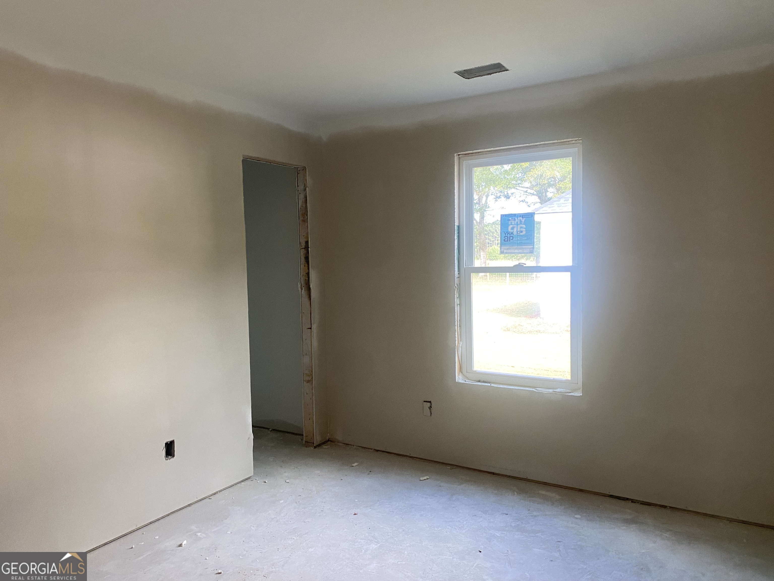 166 Mathews Road Milner, GA 30257 - Photo 12 of 14 an empty room with a window