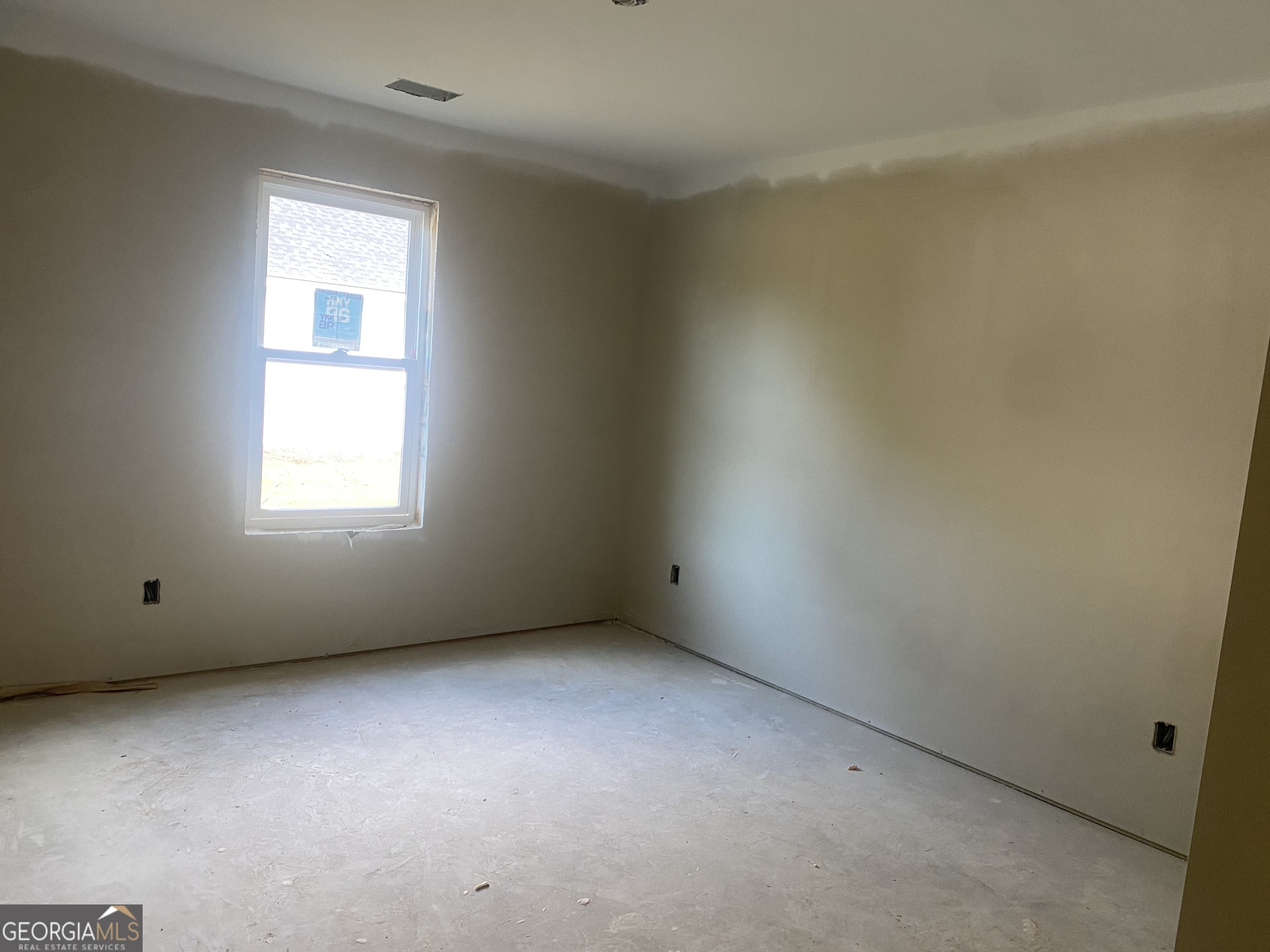 166 Mathews Road Milner, GA 30257 - Photo 14 of 14 an empty room with a window