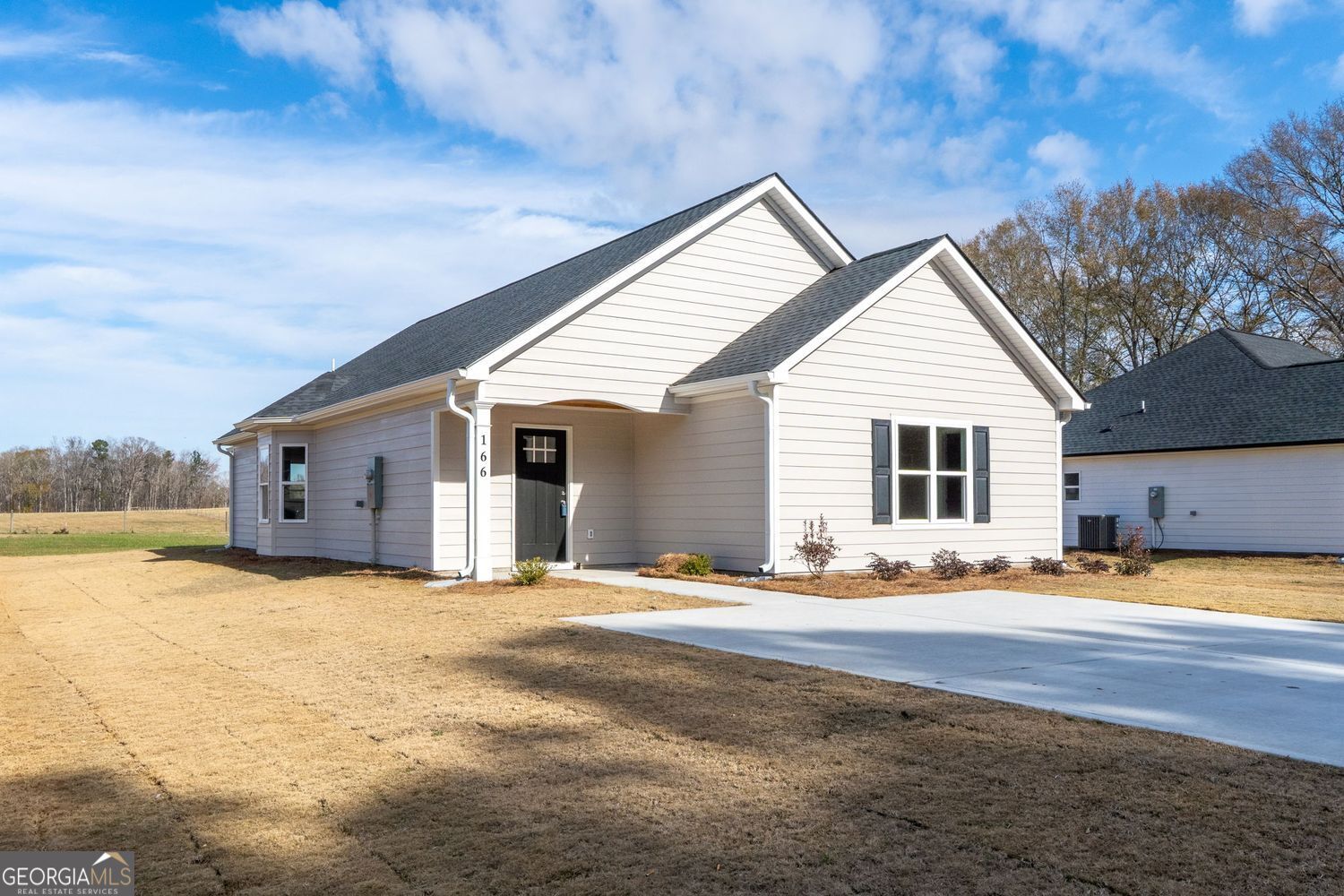 166 Mathews Road Milner, GA 30257 - Photo 2 of 32 a view of a house with snow on the background