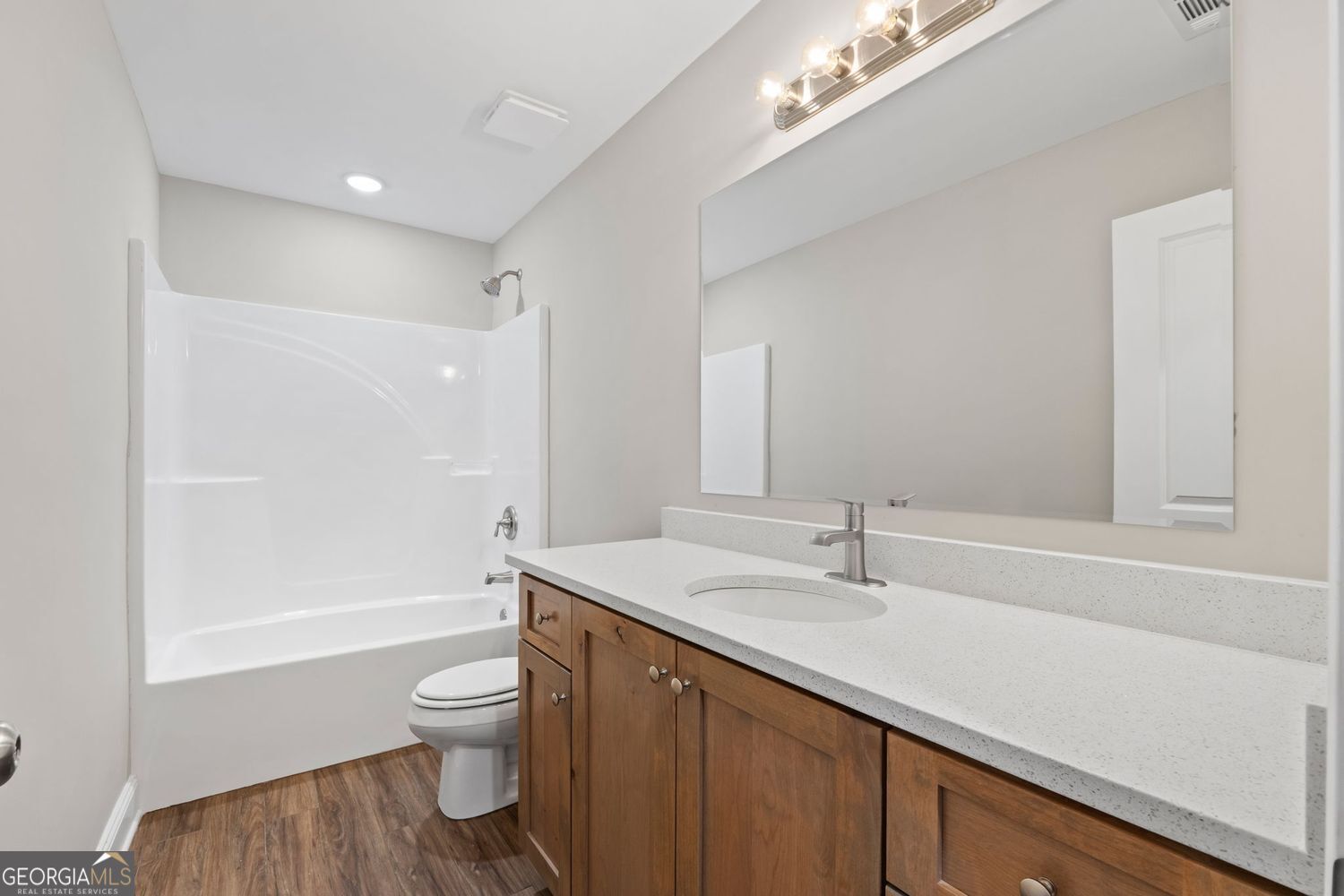 166 Mathews Road Milner, GA 30257 - Photo 25 of 32 a bathroom with a sink a toilet and shower