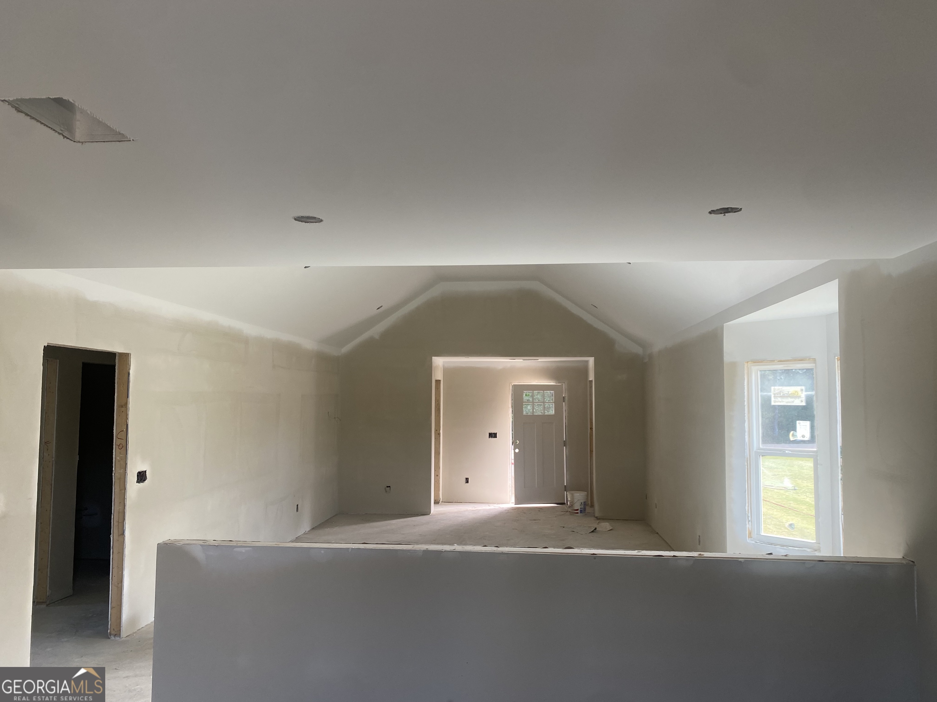 166 Mathews Road Milner, GA 30257 - Photo 10 of 14 a view of a livingroom with a staircase