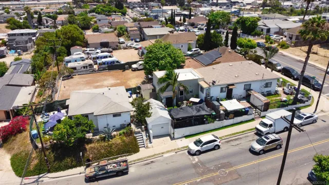 an aerial view of a yard with parking