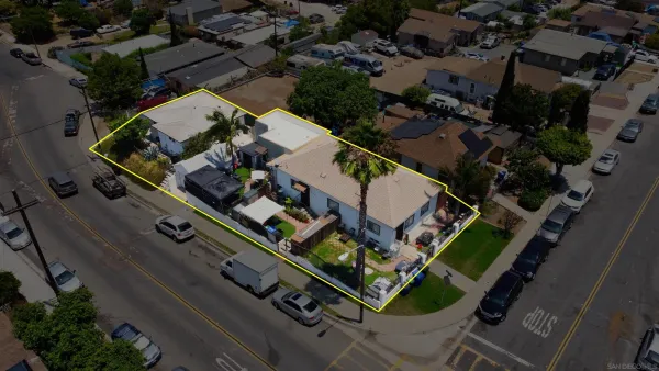 an aerial view of house with a yard