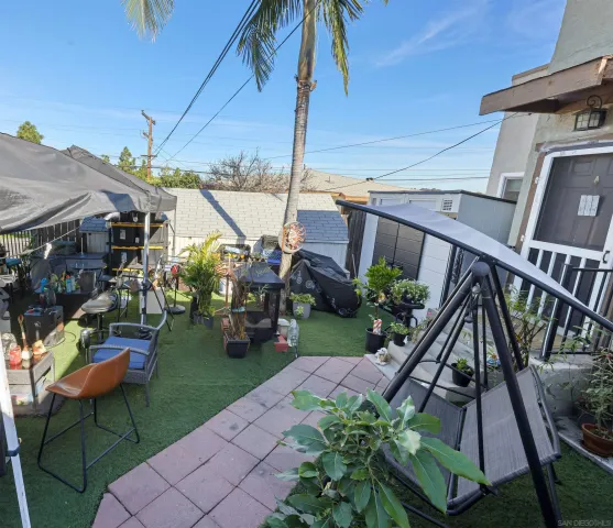 a view of an chairs and table in the patio