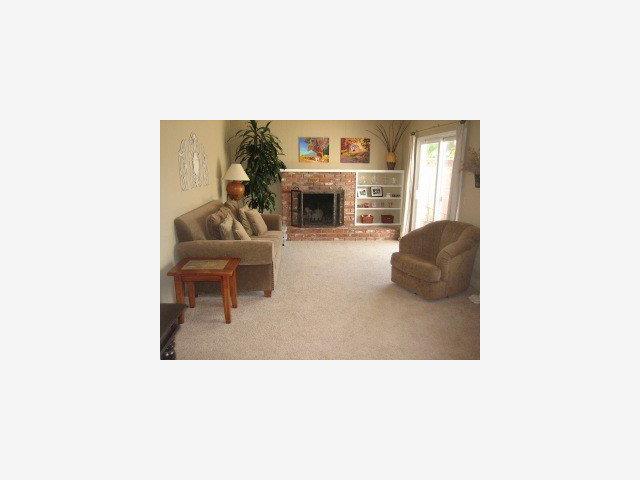 863 Amesti Road Watsonville, CA 95076 - Photo 4 of 9 a living room with furniture and a fireplace
