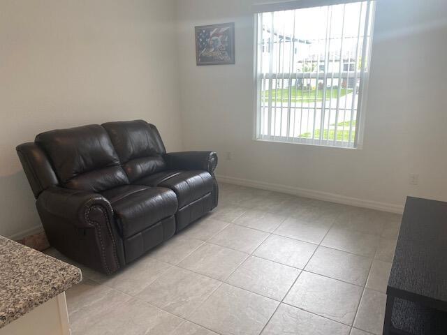 5133 Armina Place, Unit STUDIO Fort Pierce, FL 34951 - Photo 18 of 18 a living room with furniture and a window