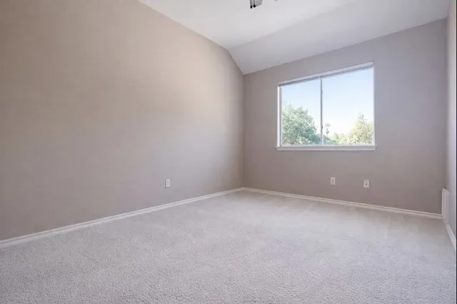 an empty room with closet area