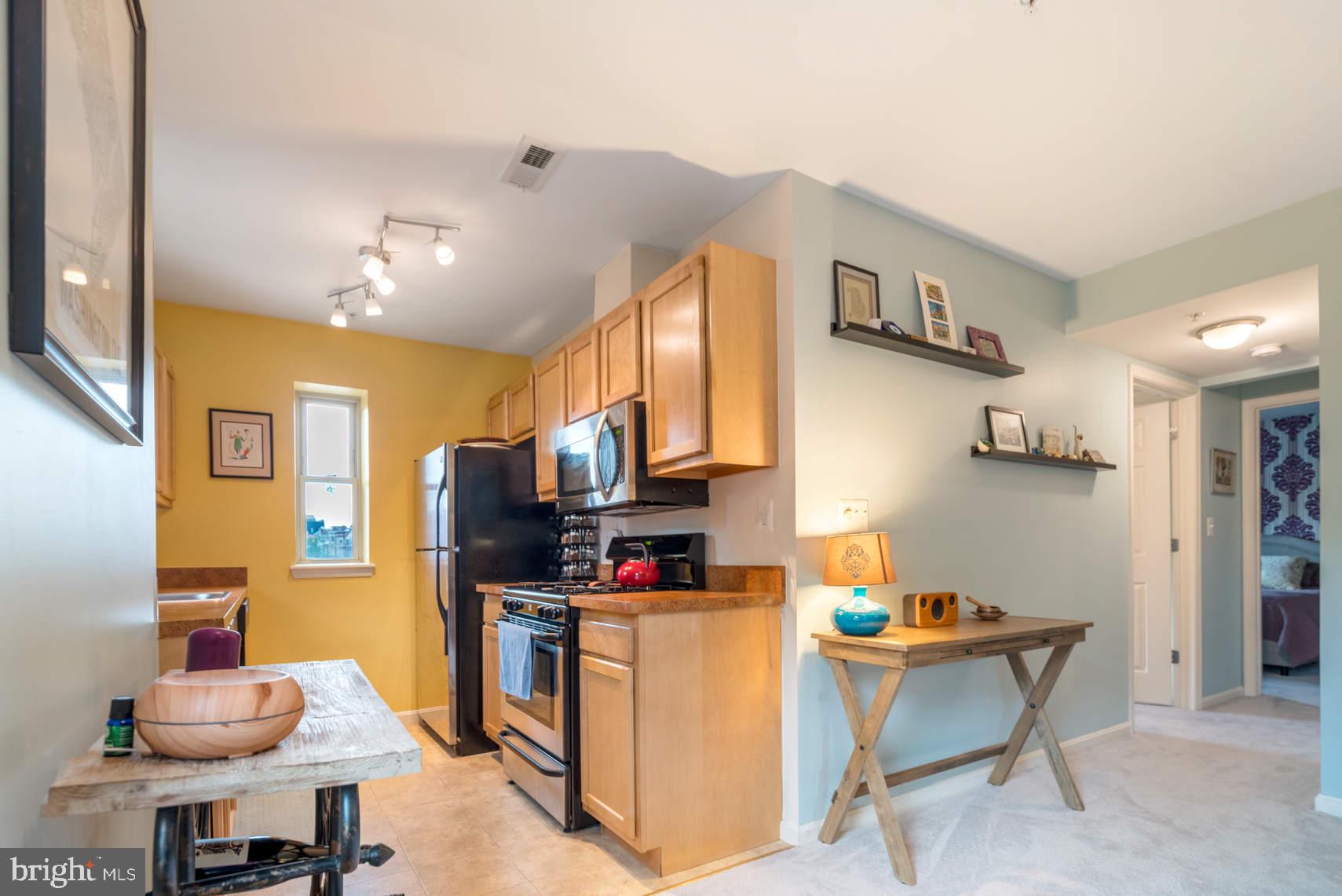 1343 Clifton Street Northwest, Unit 302 Washington, DC 20009 - Photo 4 of 11 Kitchen and hallway