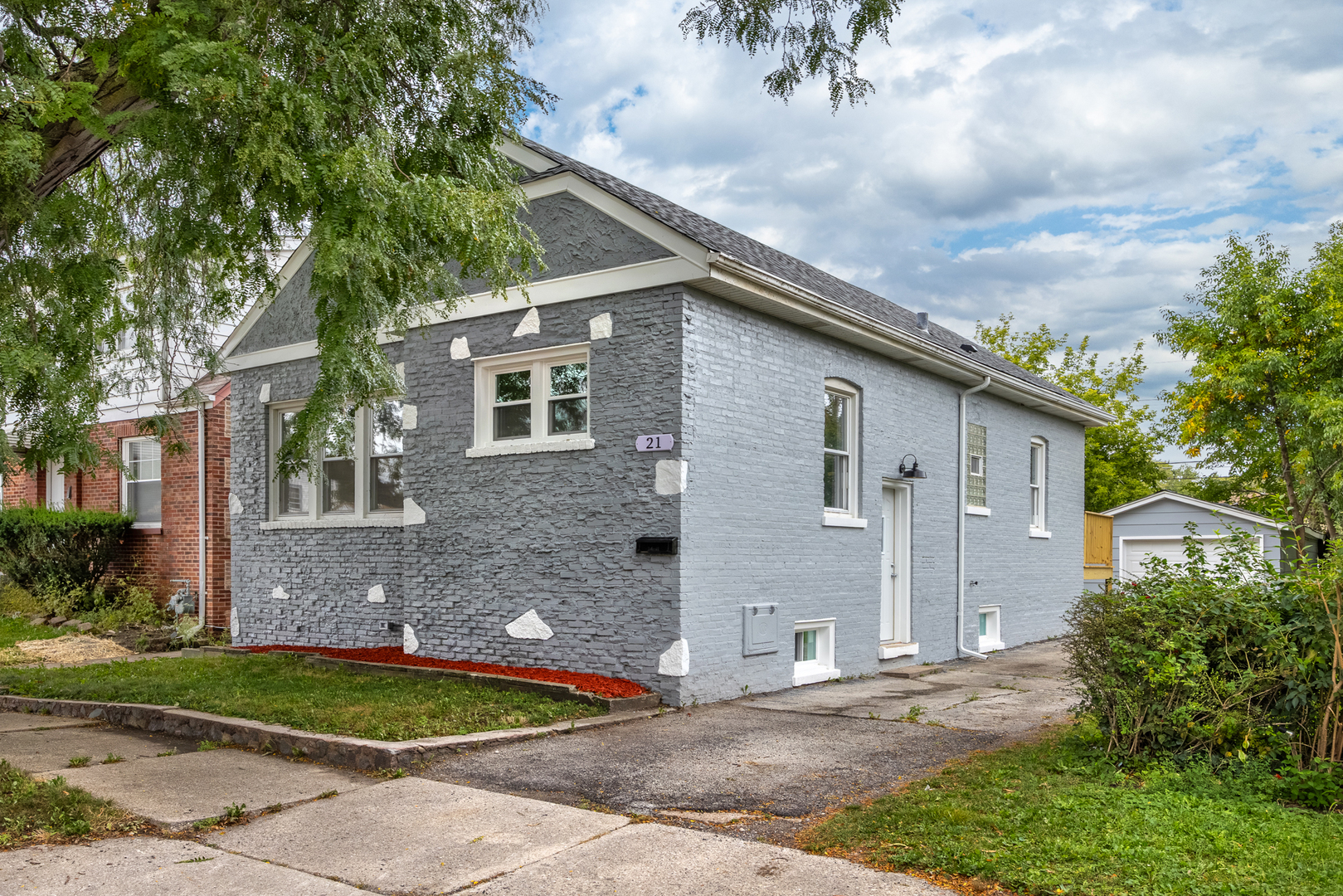 a front view of a house with garden