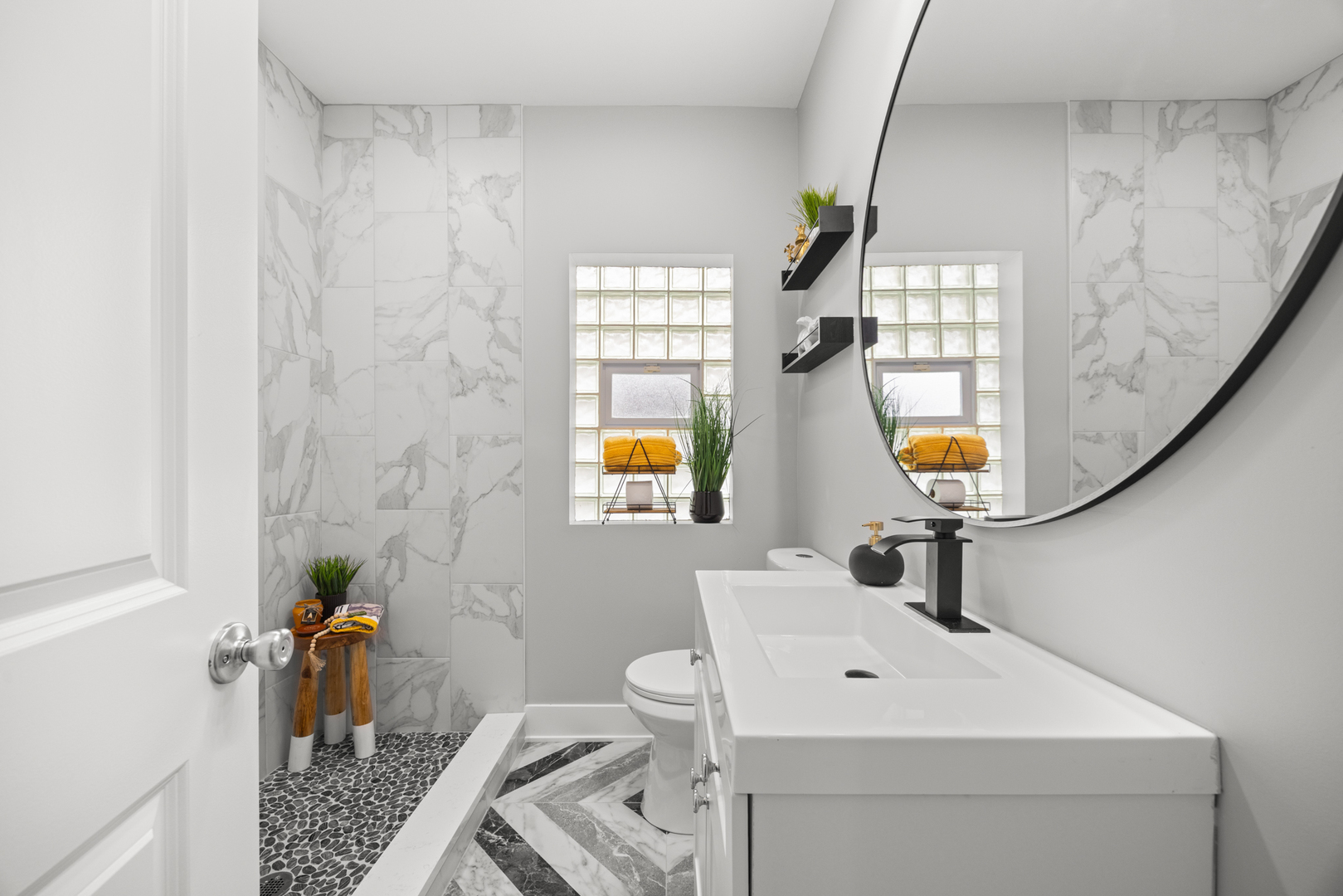 21 East 140th Court Riverdale, IL 60827 - Photo 13 of 29 a bathroom with a sink a toilet and a mirror