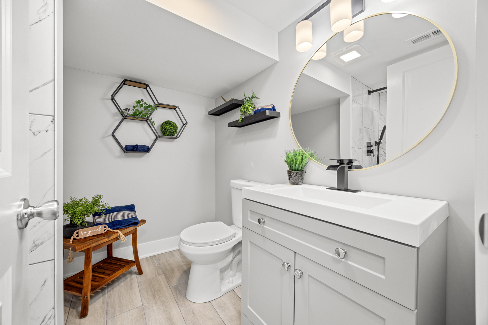 21 East 140th Court Riverdale, IL 60827 - Photo 15 of 29 a bathroom with a sink a toilet and a mirror