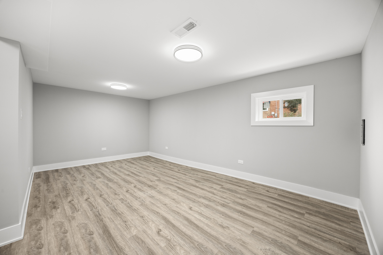 21 East 140th Court Riverdale, IL 60827 - Photo 17 of 29 an empty room with wooden floor and windows