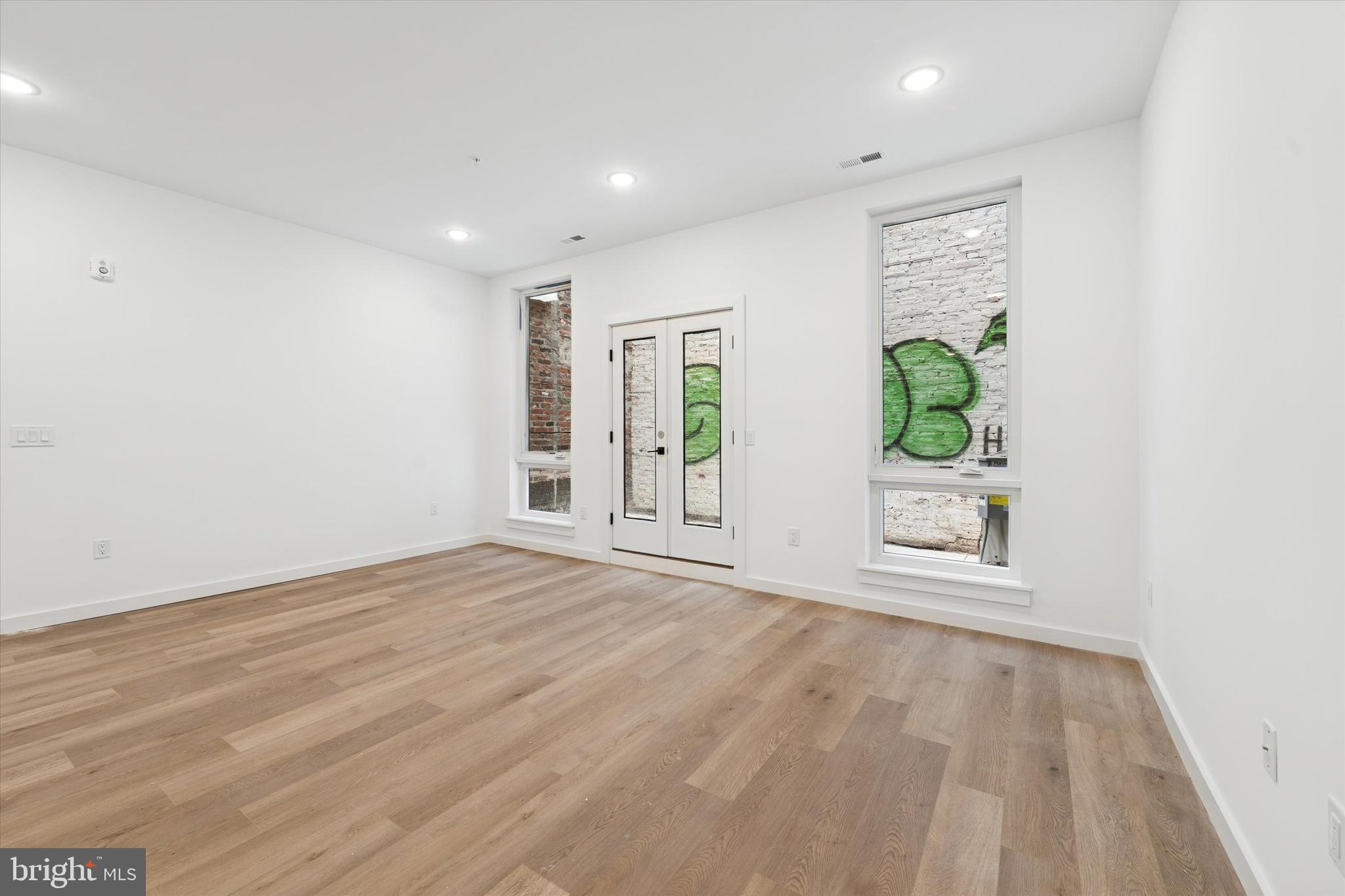 754 South 4th Street, Unit 101 Philadelphia, PA 19147 - Photo 1 of 14 a view of an empty room with a window