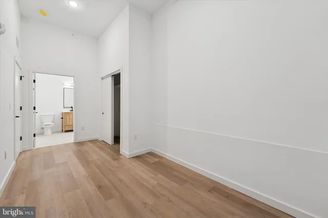 a view of a room with wooden floor