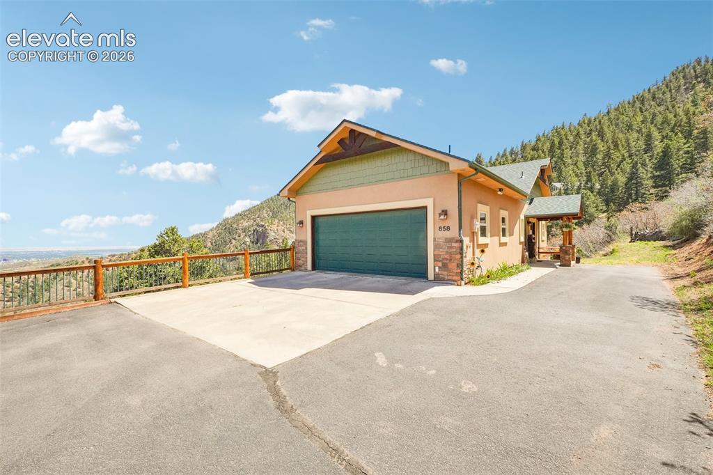858 Oak Ridge Road Manitou Springs, CO 80829 - Photo 2 of 50 Front of home surrounded by 360 degree views of mountains and Colorado Springs