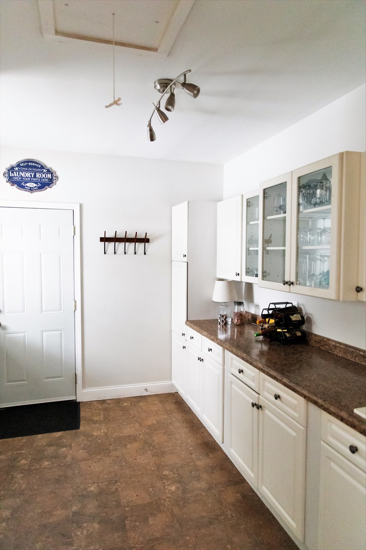 2119 Fairfield Road Lindenhurst, IL 60046 - Photo 19 of 22 a kitchen with granite countertop a refrigerator and a sink